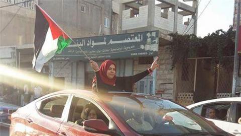 Amal al-Sada heads towards her home in Halhul, Hebron, after being released from prison